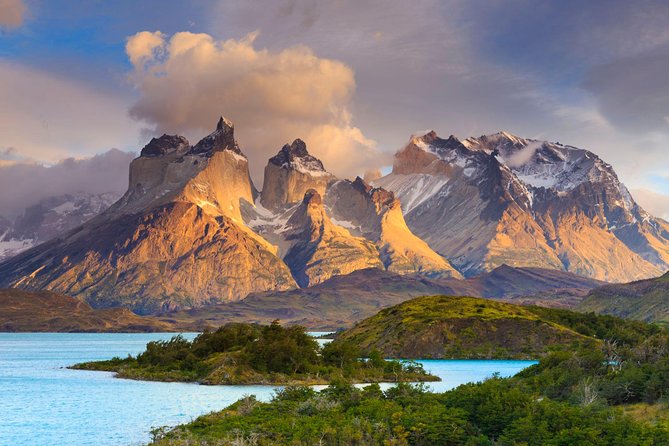 Lush green mountains and ancient stone ruins in the Andes region.